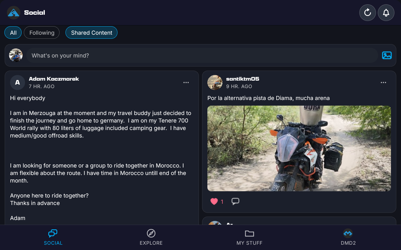 The HUB Feed opened from the DMD HUB icon, full screen: the DMD HUB icon and Social in the title bar with refresh and the bell, All, Following and Shared Content above What's on your mind?, riders' posts in two columns, and Social, Explore, My Stuff and DMD2 along the bottom