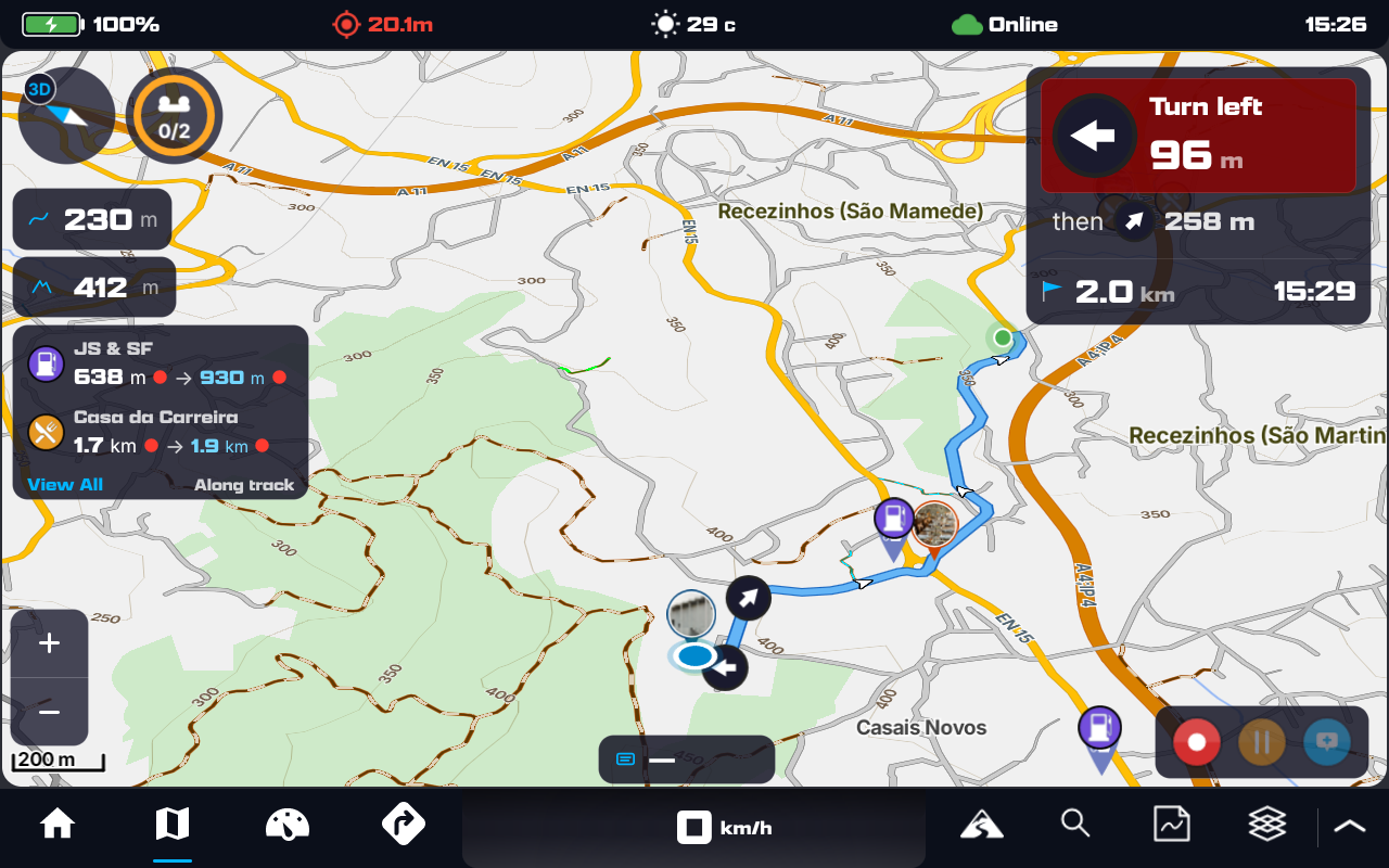 DMD Next navigating: a blue route on the map, the turn instruction card top-right, position icon, and on-map overlays
