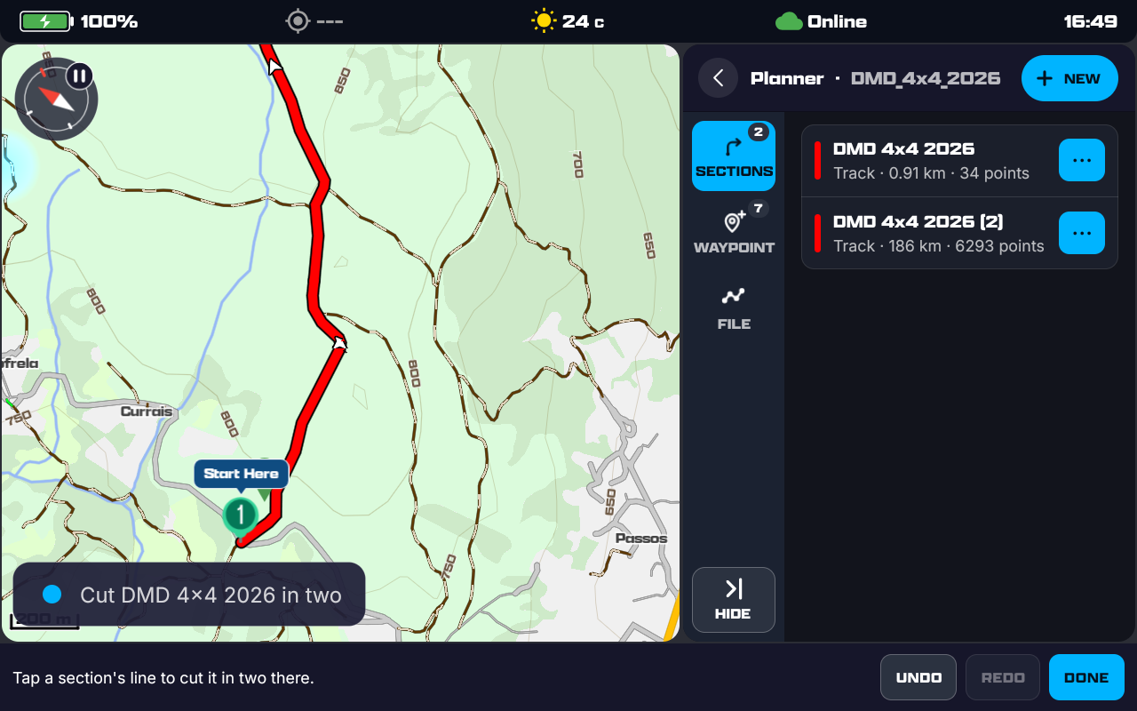 The cut tool on: a red track on the map, the sections list showing DMD 4x4 2026 (0.91 km, 34 points) and DMD 4x4 2026 (2) (186 km, 6293 points), the toast Cut DMD 4x4 2026 in two, and the bar reading Tap a section's line to cut it in two there, with UNDO, REDO and DONE.