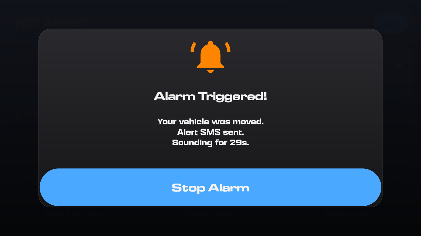 Alarm Triggered overlay on the head unit: your vehicle was moved, alert SMS sent, sounding for 29 seconds, and a Stop Alarm button